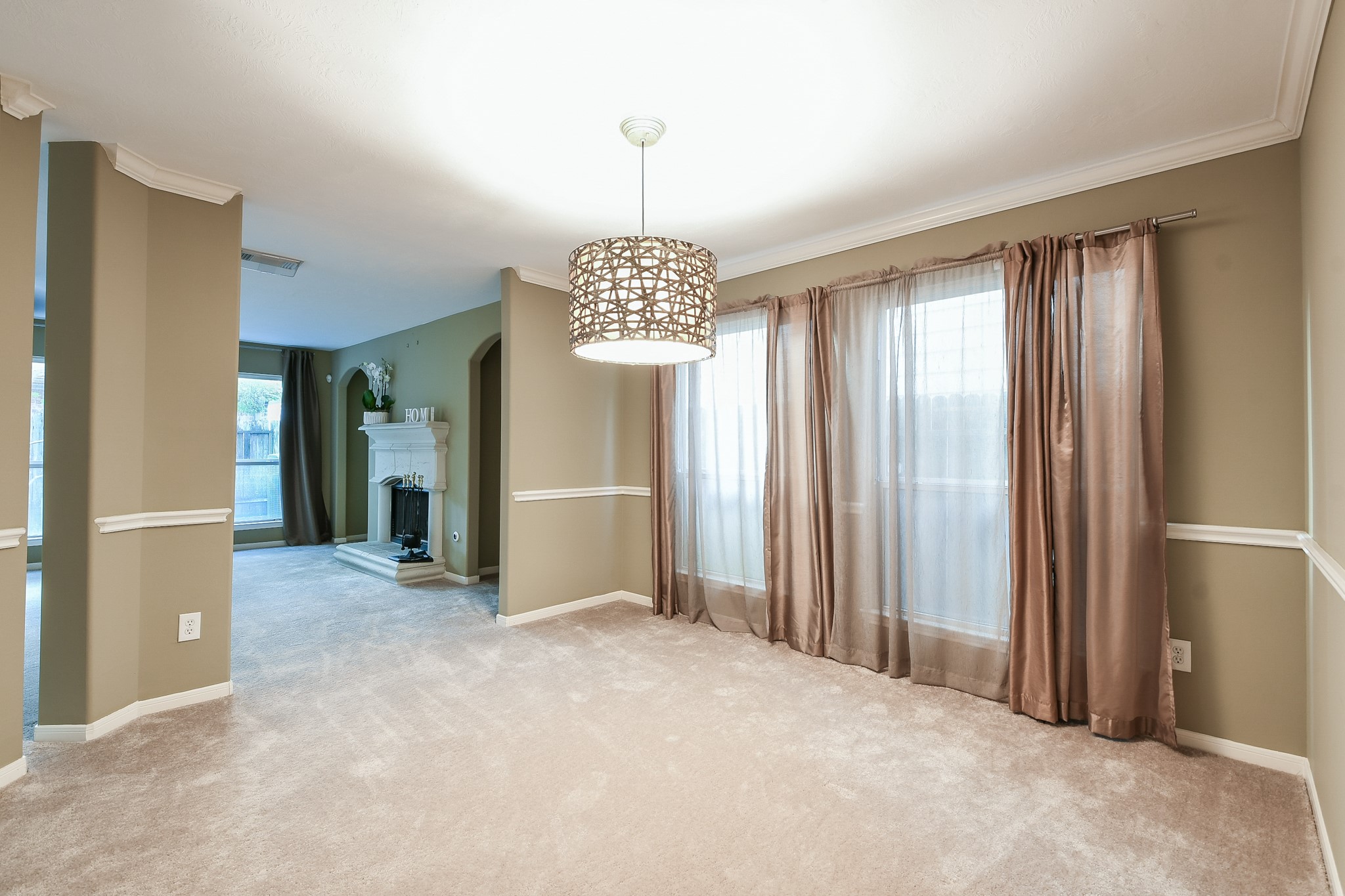 2415 Lacyberry Street Houston, TX 77080 - Photo 6 of 36 a view of a hallway with windows and chandelier