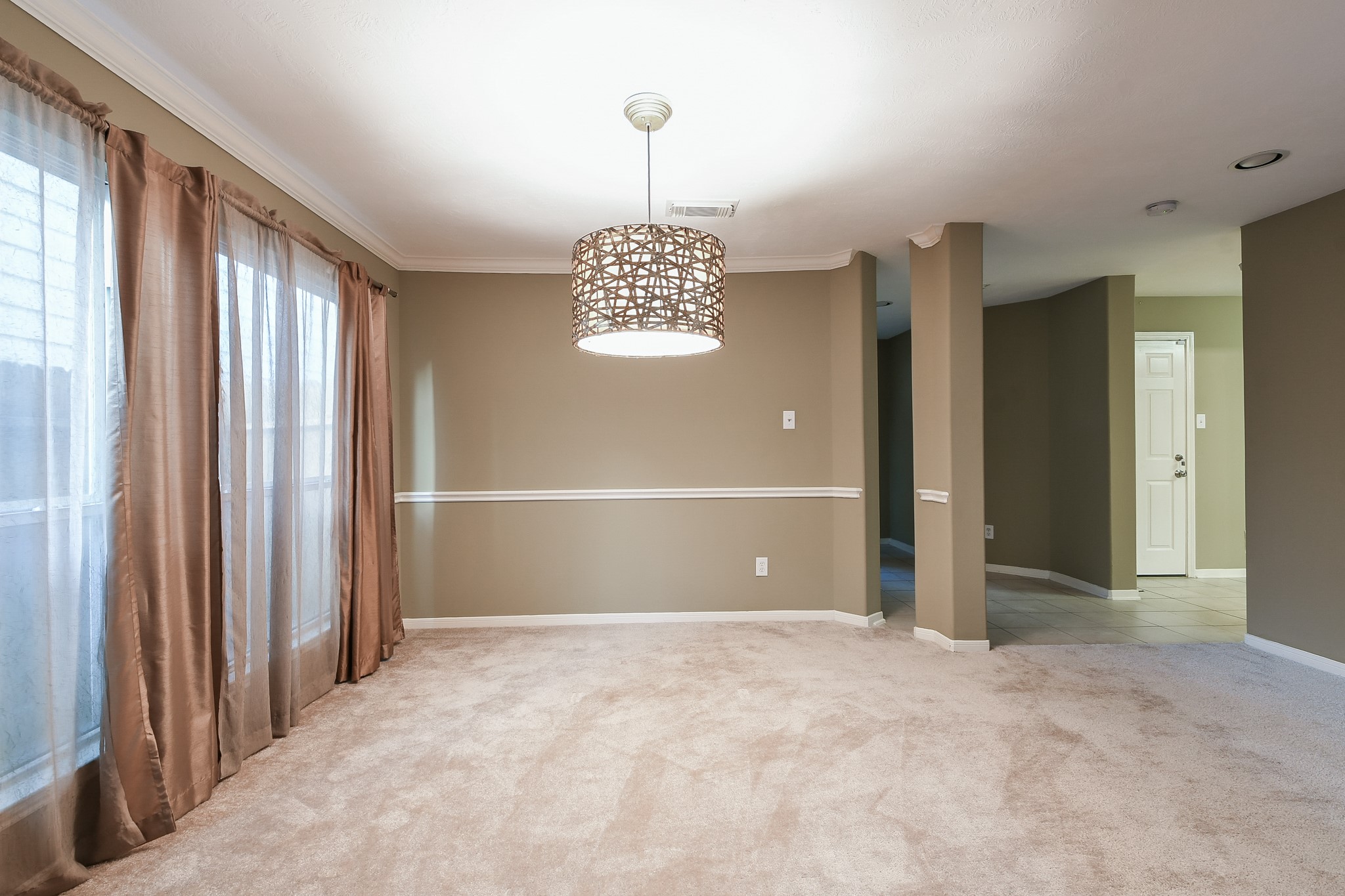 2415 Lacyberry Street Houston, TX 77080 - Photo 7 of 36 an empty room with windows and entrance