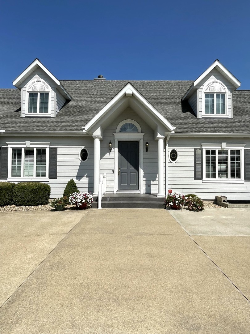 2239 Riverview Road Rock Falls, IL 61071 - Photo 4 of 70 a view of a brick house with a large space and large windows