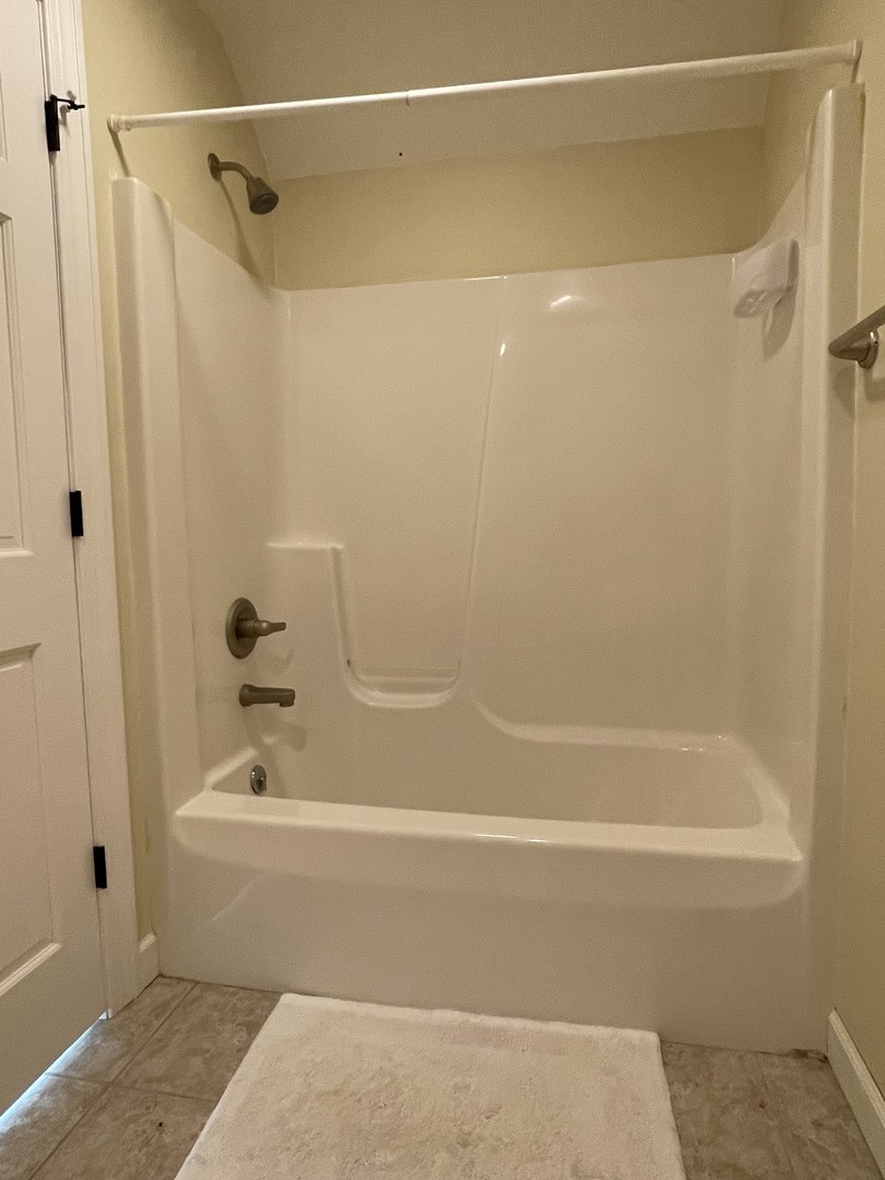 2239 Riverview Road Rock Falls, IL 61071 - Photo 44 of 70 a bathroom with a shower and a bath tub