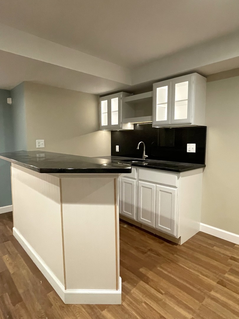 2239 Riverview Road Rock Falls, IL 61071 - Photo 56 of 70 a kitchen with stainless steel appliances a sink a stove a microwave a sink and white cabinets