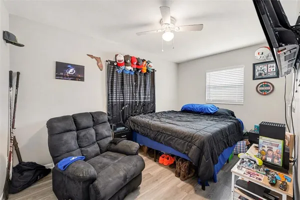 a bedroom with bed and a couch