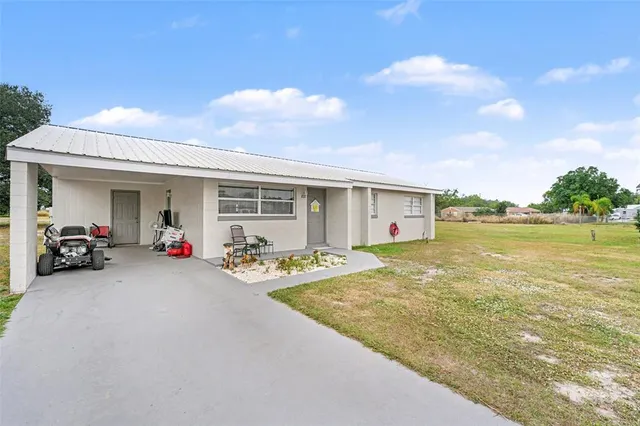 a view of a house with basketball court