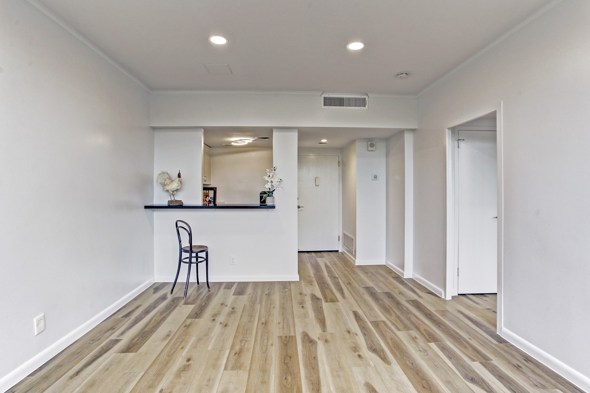 2701 Westheimer Road, Unit 2J Houston, TX 77098 - Photo 2 of 10 a view of a kitchen with wooden floor