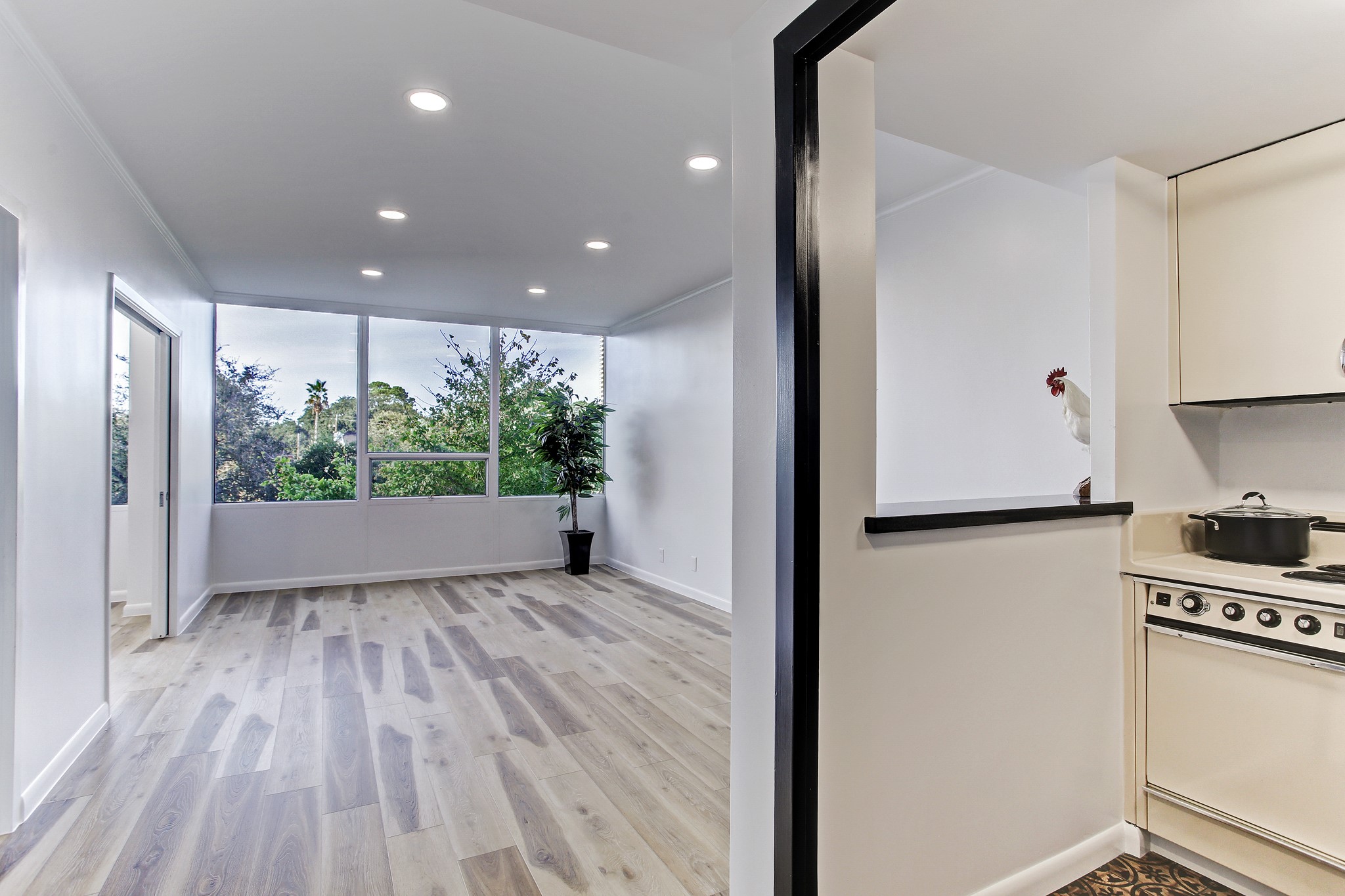 2701 Westheimer Road, Unit 2J Houston, TX 77098 - Photo 3 of 10 a view of kitchen with wooden floor and electronic appliances