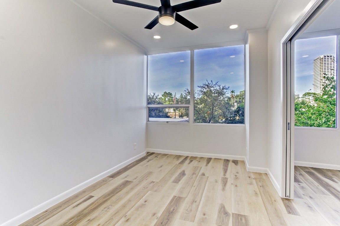 2701 Westheimer Road, Unit 2J Houston, TX 77098 - Photo 8 of 10 Bedroom with remote controlled ceiling fan with light.