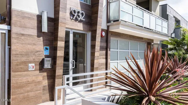 a view of a building with a door and balcony