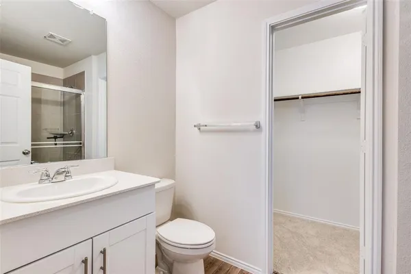 a bathroom with a sink toilet and vanity