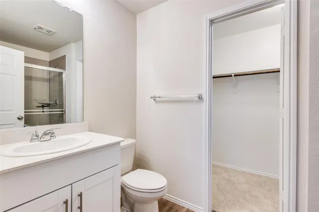 a bathroom with a sink toilet and vanity