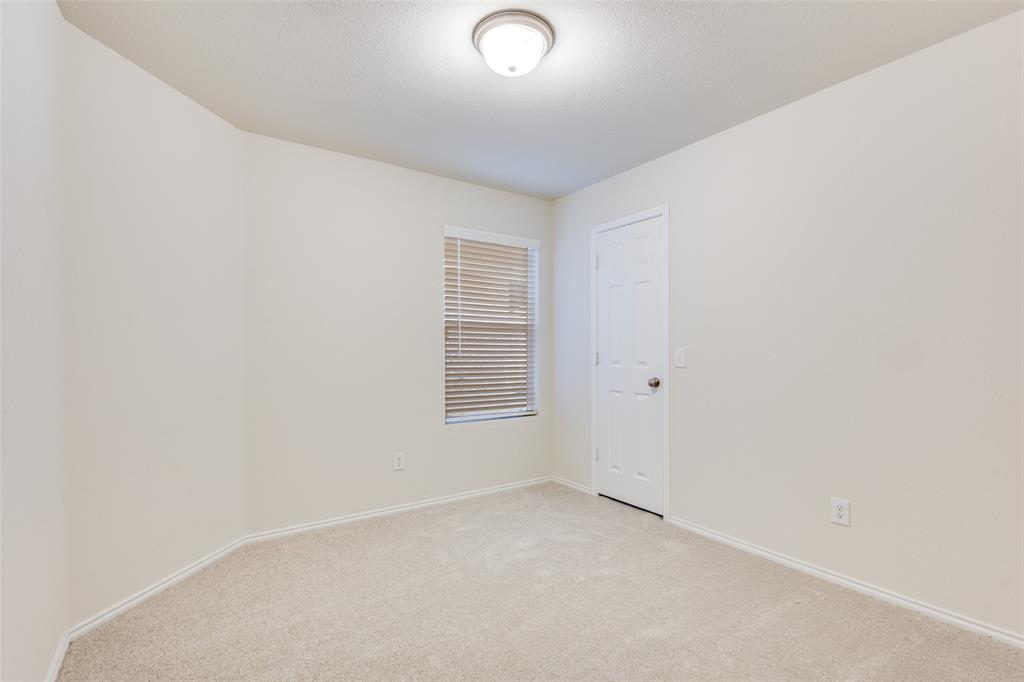 843 Ozark Path Princeton, TX 75407 - Photo 10 of 13 an empty room with a window