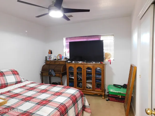 a front view of a house with sitting area and furniture