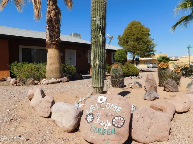 a view of a house with a snow in the yard