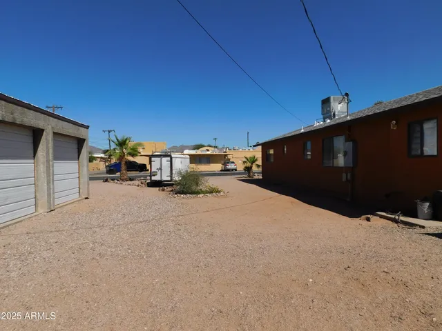 a view of a house with a snow in the yard