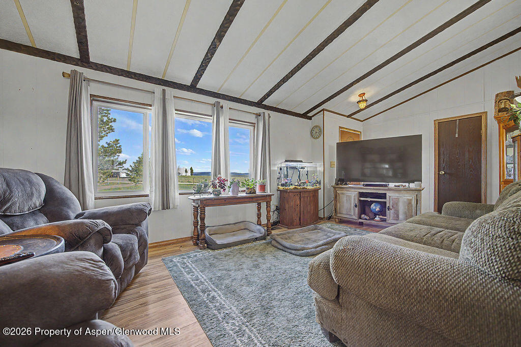 723 Barbara Drive Craig, CO 81625 - Photo 26 of 48 a living room with furniture and a large window