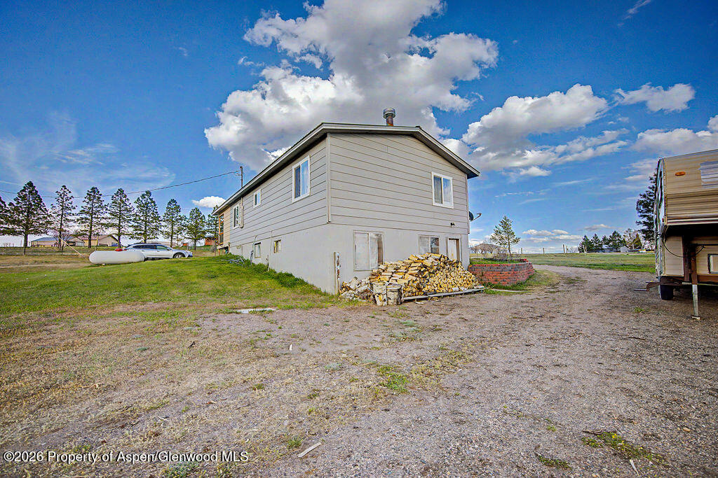 723 Barbara Drive Craig, CO 81625 - Photo 4 of 48 a view of a house with a yard