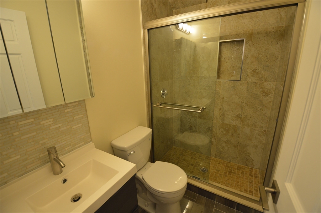 1801 Beacon Street, Unit 2 Brookline, MA 02445 - Photo 13 of 14 a bathroom with a sink and a toilet