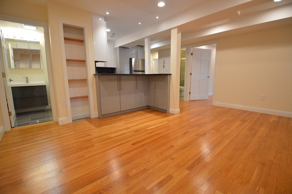 1801 Beacon Street, Unit 2 Brookline, MA 02445 - Photo 4 of 14 a view of a kitchen with refrigerator and an oven