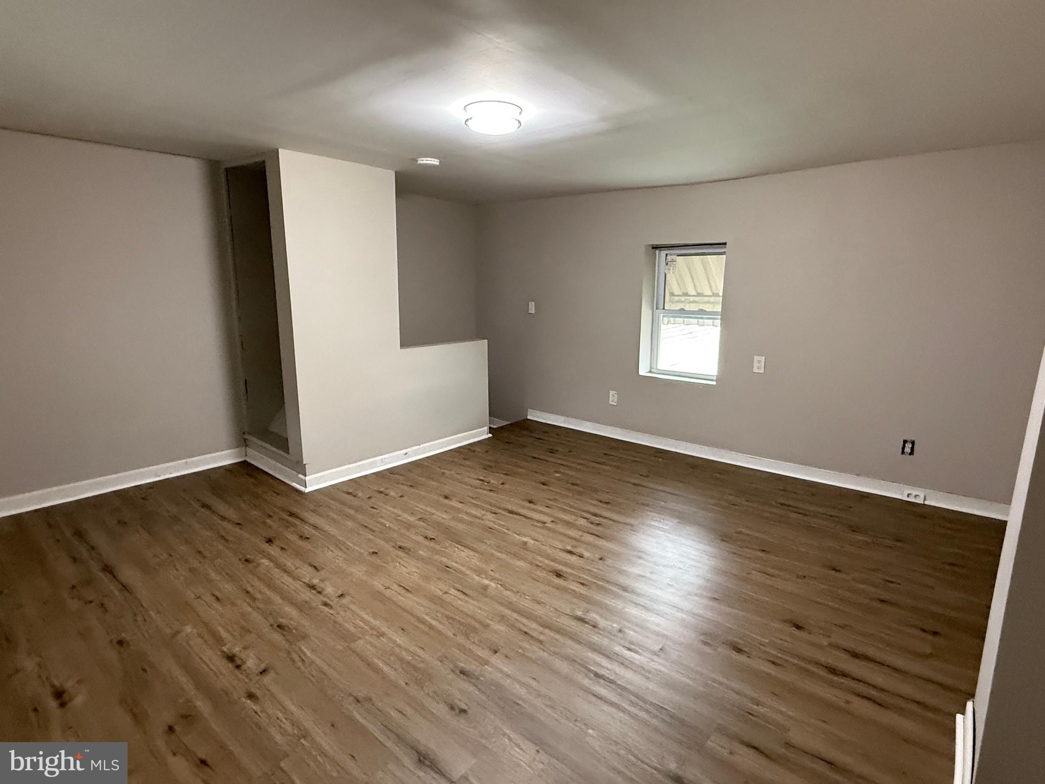 232 West Union Street Burlington, NJ 08016 - Photo 13 of 13 an empty room with wooden floor and windows