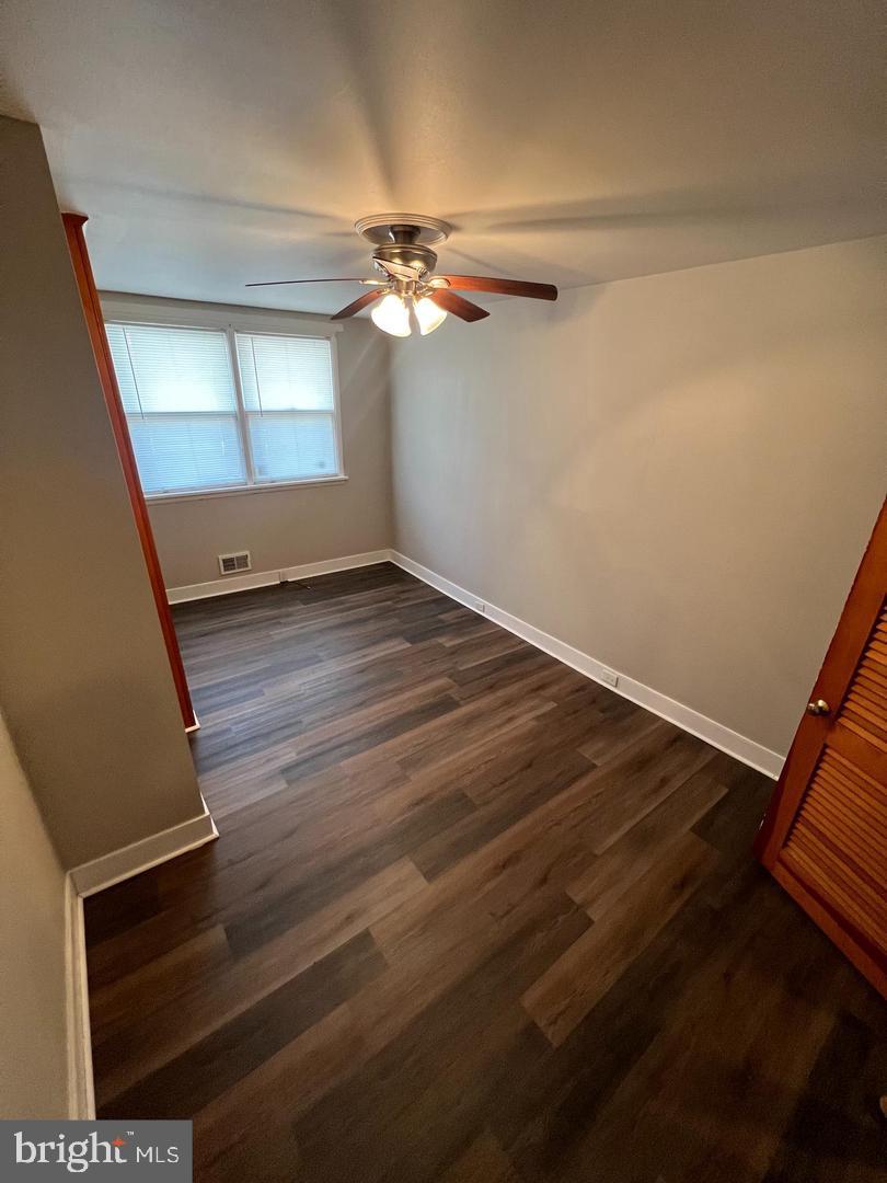 232 West Union Street Burlington, NJ 08016 - Photo 4 of 13 a view of an empty room with wooden floor and a window