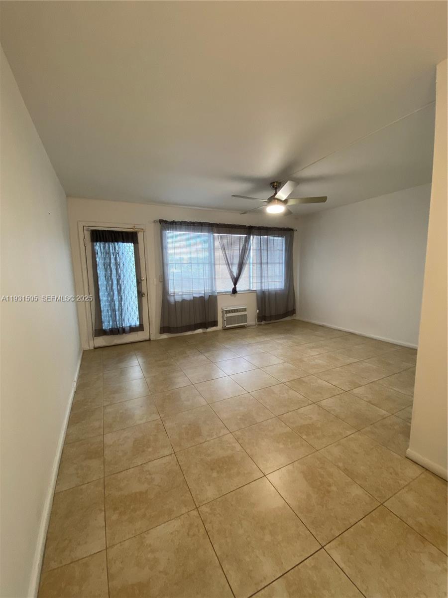 301 Southwest 135th Avenue, Unit 209C Pembroke Pines, FL 33027 - Photo 9 of 14 a view of an empty room and window