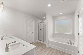 636 Bald Ridge Circle Demorest, GA 30535 - Photo 29 of 35 a bathroom with a tub sink and mirror