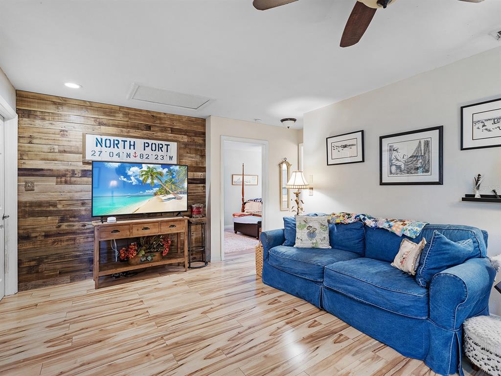 3932 Ragen Street North Port, FL 34287 - Photo 13 of 40 a living room with furniture and a flat screen tv