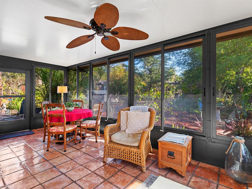3932 Ragen Street North Port, FL 34287 - Photo 20 of 40 a living room with furniture and floor to ceiling windows