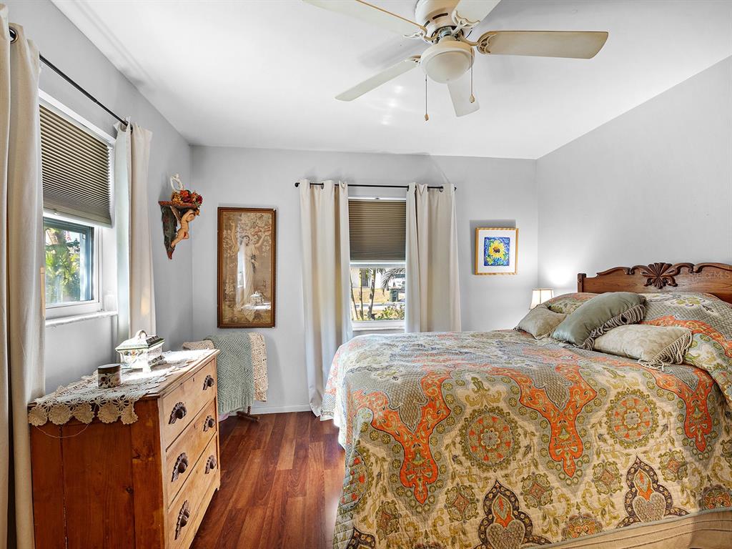 3932 Ragen Street North Port, FL 34287 - Photo 23 of 40 a bedroom with a bed and a chandelier