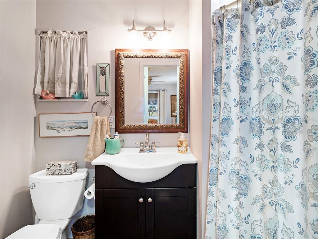 3932 Ragen Street North Port, FL 34287 - Photo 24 of 40 a bathroom with a sink toilet and mirror
