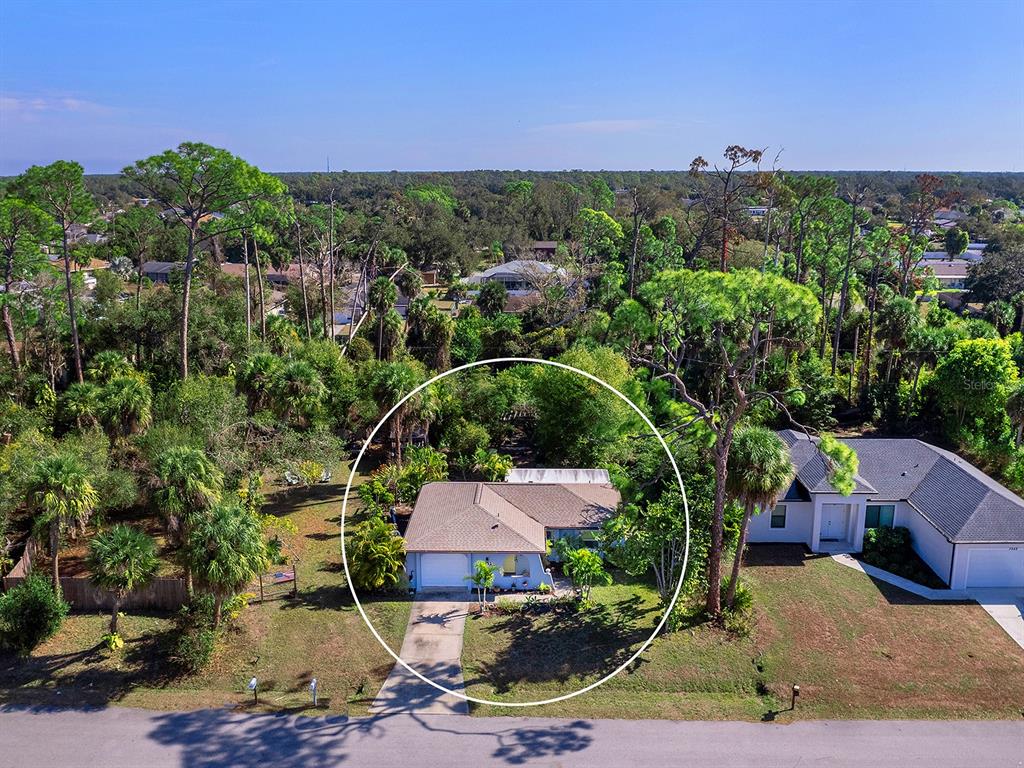 3932 Ragen Street North Port, FL 34287 - Photo 35 of 40 a view of a house with a yard