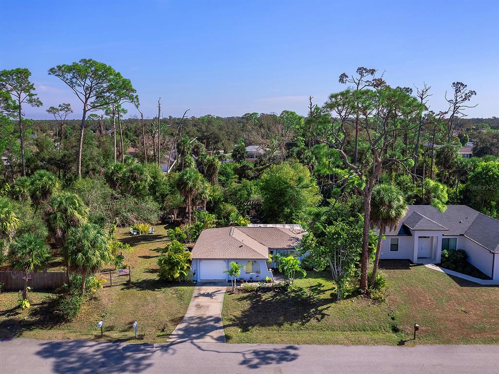 3932 Ragen Street North Port, FL 34287 - Photo 39 of 40 an aerial view of a house with yard and seating space