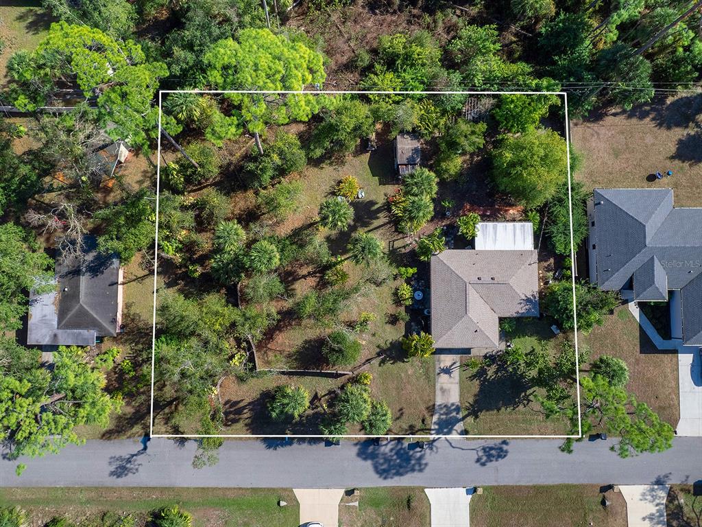 3932 Ragen Street North Port, FL 34287 - Photo 4 of 40 an aerial view of a house with a yard and lake view