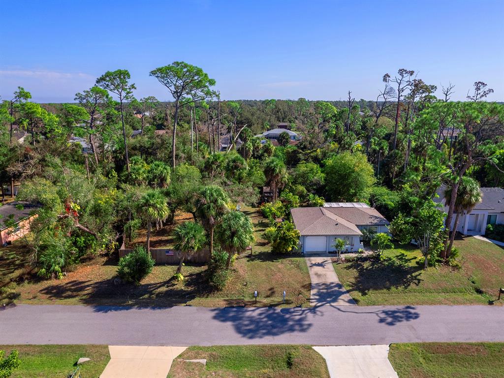 3932 Ragen Street North Port, FL 34287 - Photo 5 of 40 an aerial view of a house with a yard