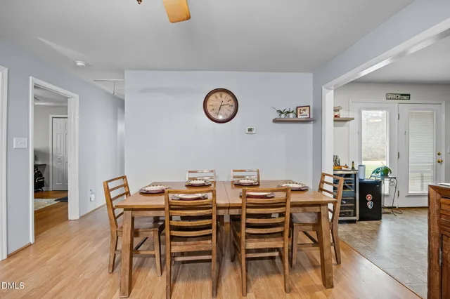 a view of a dining room with furniture and wooden floor