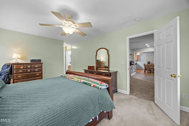 a bedroom with furniture and a chandelier