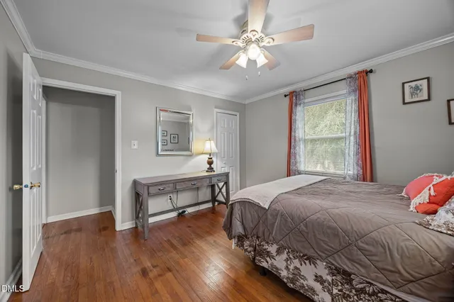 a bedroom with a bed and a table