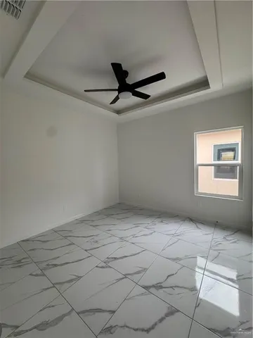 a view of an empty room and window