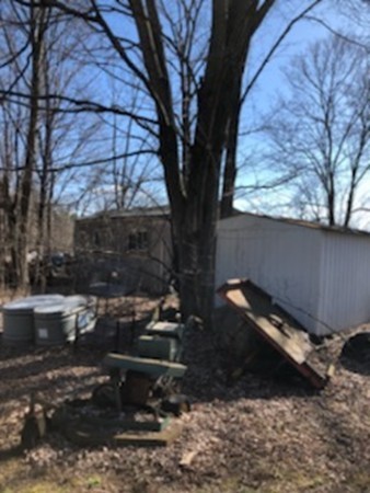 35 Randall Road Berlin, MA 01503 - Photo 10 of 20 a backyard of a house with outdoor seating