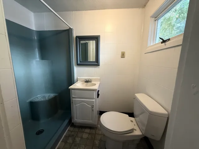 a bathroom with a toilet and a sink