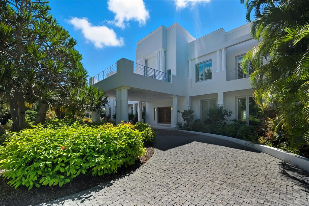 3315 Bay Shore Road Sarasota, FL 34234 - Photo 3 of 90 a front view of a house with a yard