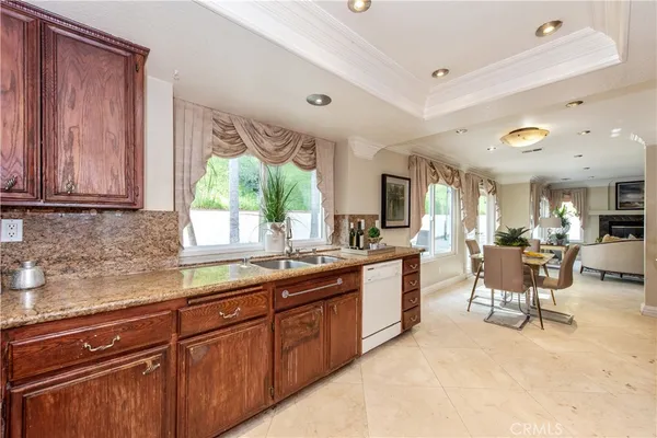 a kitchen with sink cabinets and window