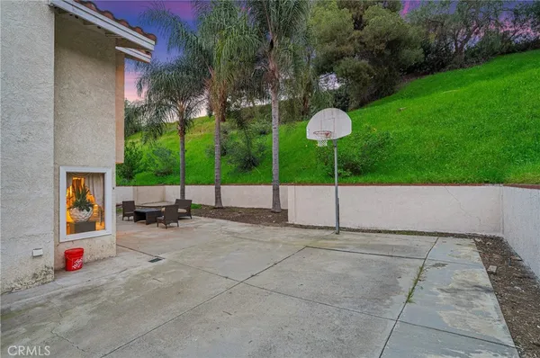a view of an outdoor space with lounge chair