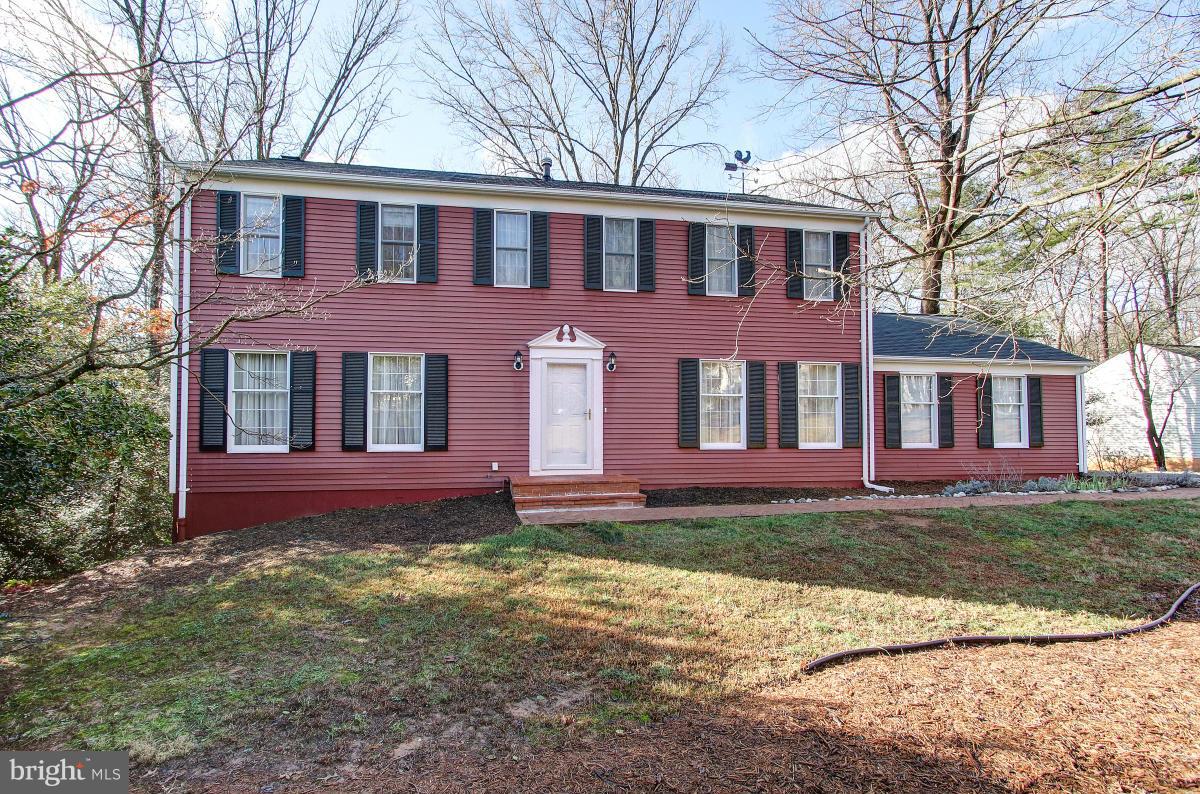 11419 Running Cedar Road Reston, VA 20191 - Photo 2 of 30 a front view of a house with a yard