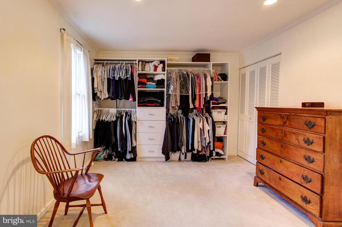 11419 Running Cedar Road Reston, VA 20191 - Photo 14 of 30 a view of walk in closet with clothes and shoes