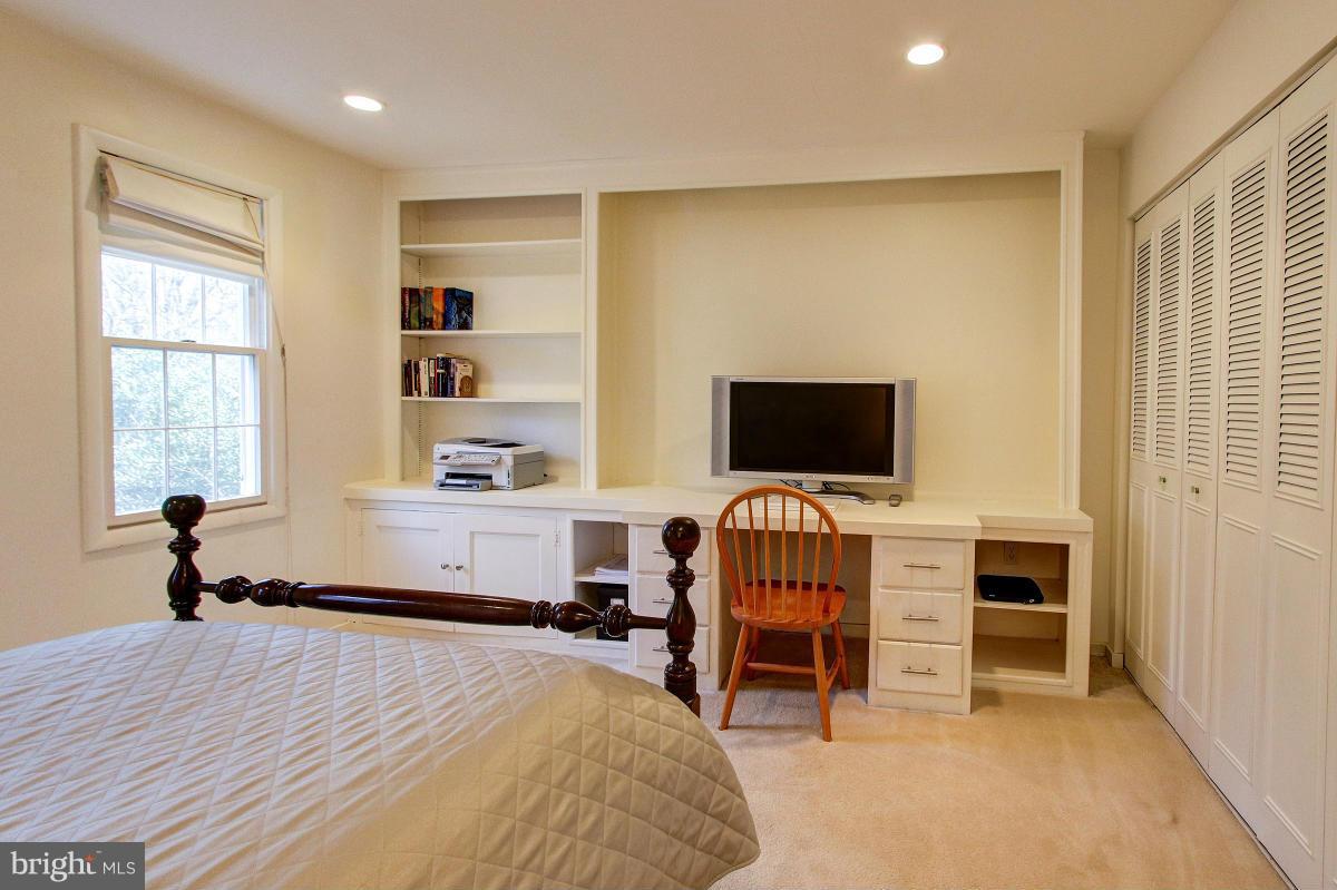 11419 Running Cedar Road Reston, VA 20191 - Photo 17 of 30 a bedroom with furniture and a flat screen tv