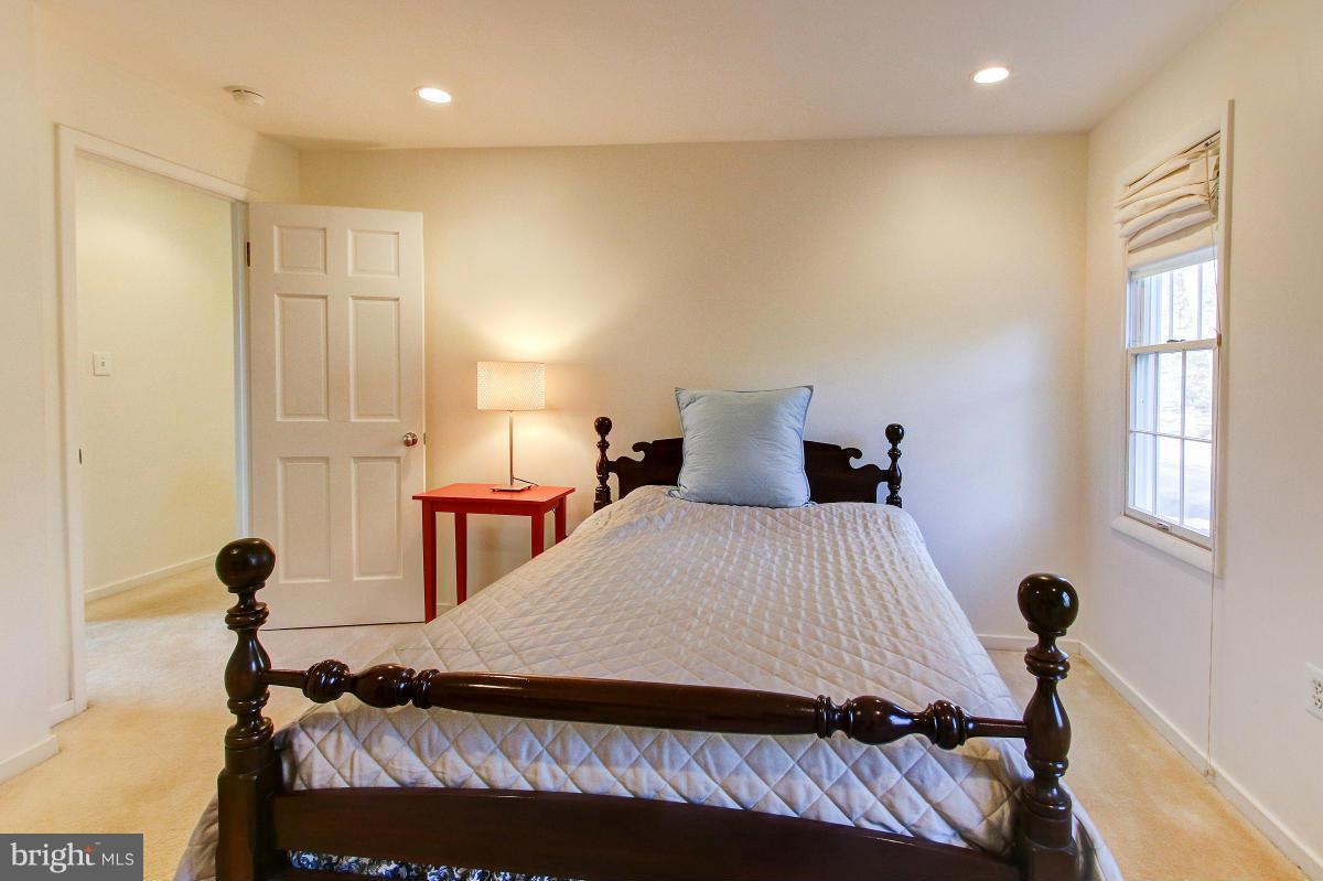 11419 Running Cedar Road Reston, VA 20191 - Photo 18 of 30 a bedroom with a bed and a window