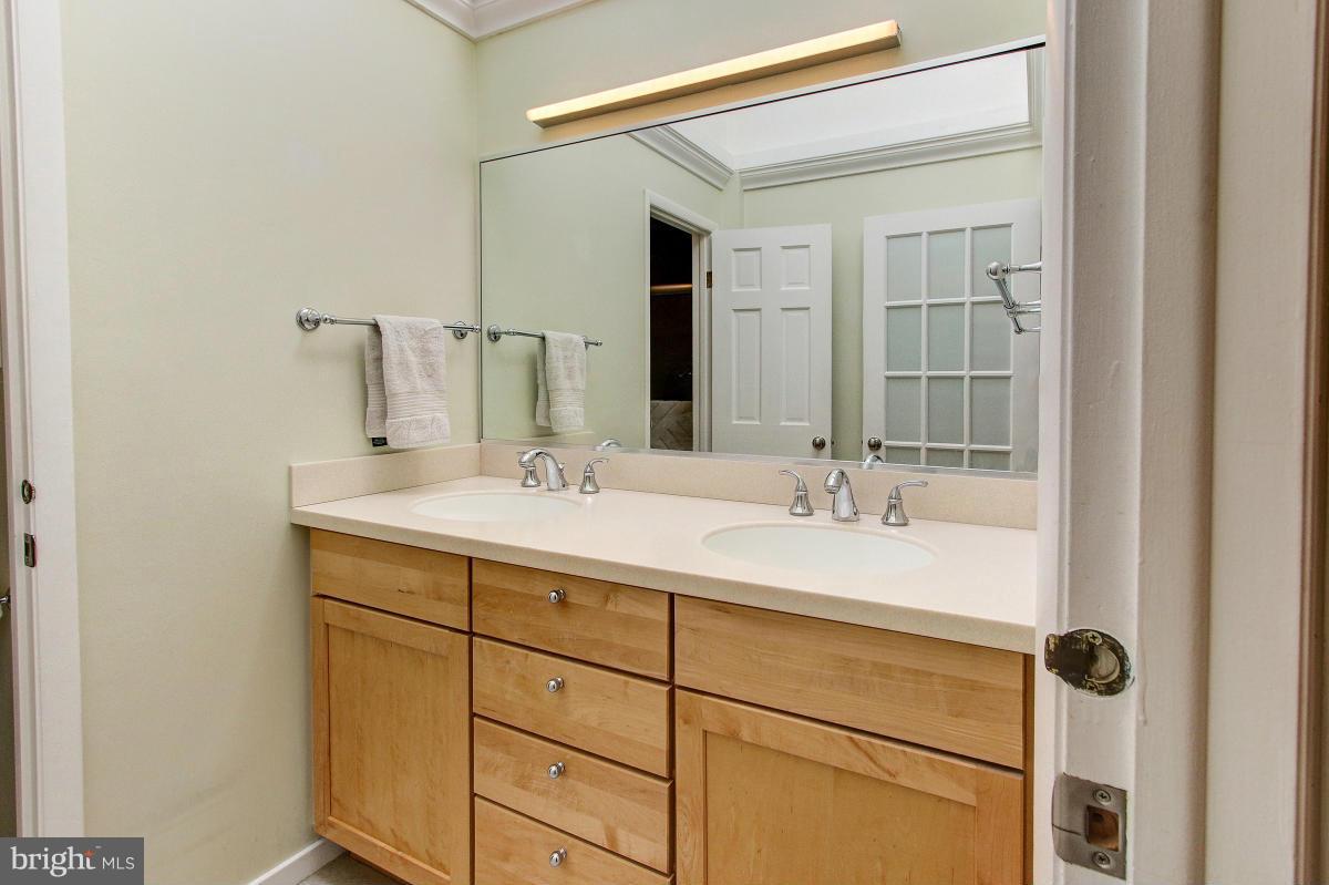 11419 Running Cedar Road Reston, VA 20191 - Photo 21 of 30 a bathroom with a sink and a mirror