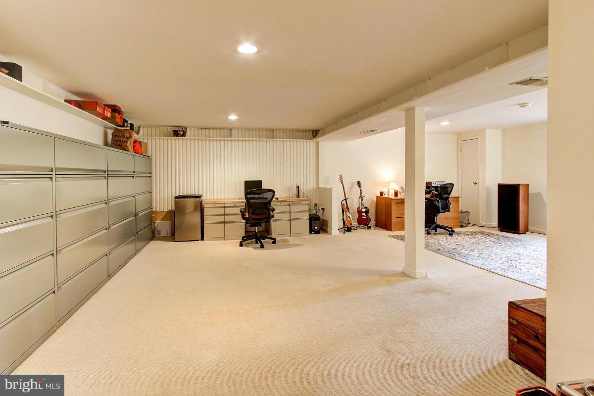 11419 Running Cedar Road Reston, VA 20191 - Photo 22 of 30 a view of a livingroom with furniture and a flat screen tv