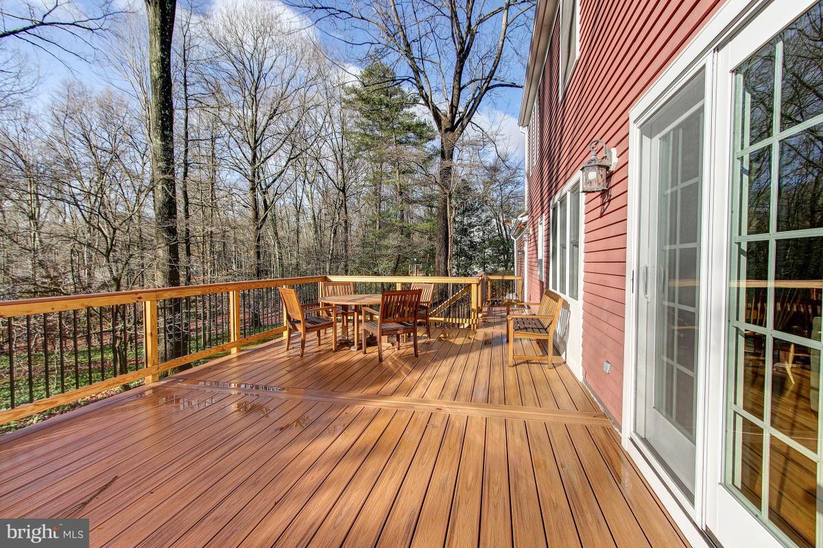 11419 Running Cedar Road Reston, VA 20191 - Photo 24 of 30 a view of a chairs on wooden deck