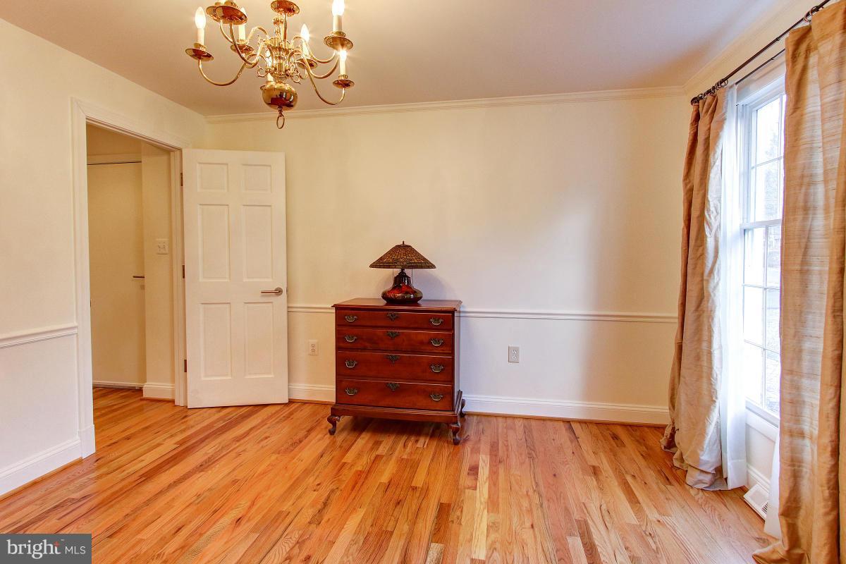 11419 Running Cedar Road Reston, VA 20191 - Photo 5 of 30 a view of empty room with wooden floor and fan